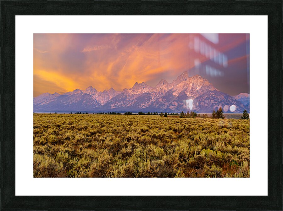 Hikers explore view of Grand Teton mountains at sunset Picture Frame print