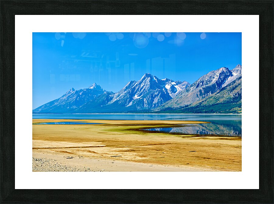 Mountains reflect in the water at Grand Teton National Park Picture Frame print