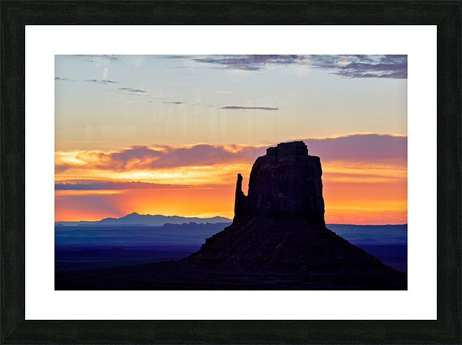 Sunset view over Monument Valley in Utah with dark silhouettes Picture Frame print