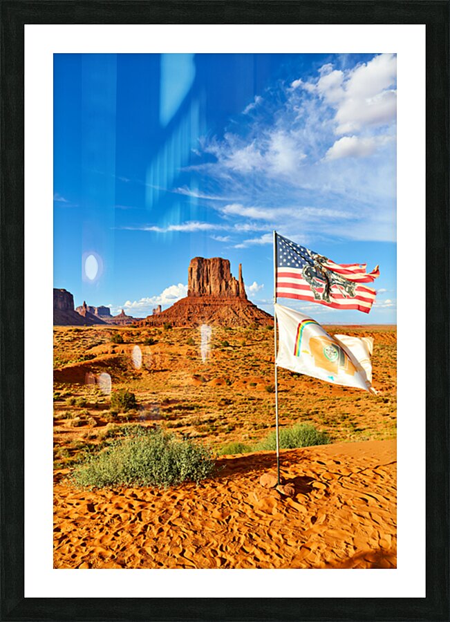 Monument Valley displays flags under blue sky in USA Picture Frame print