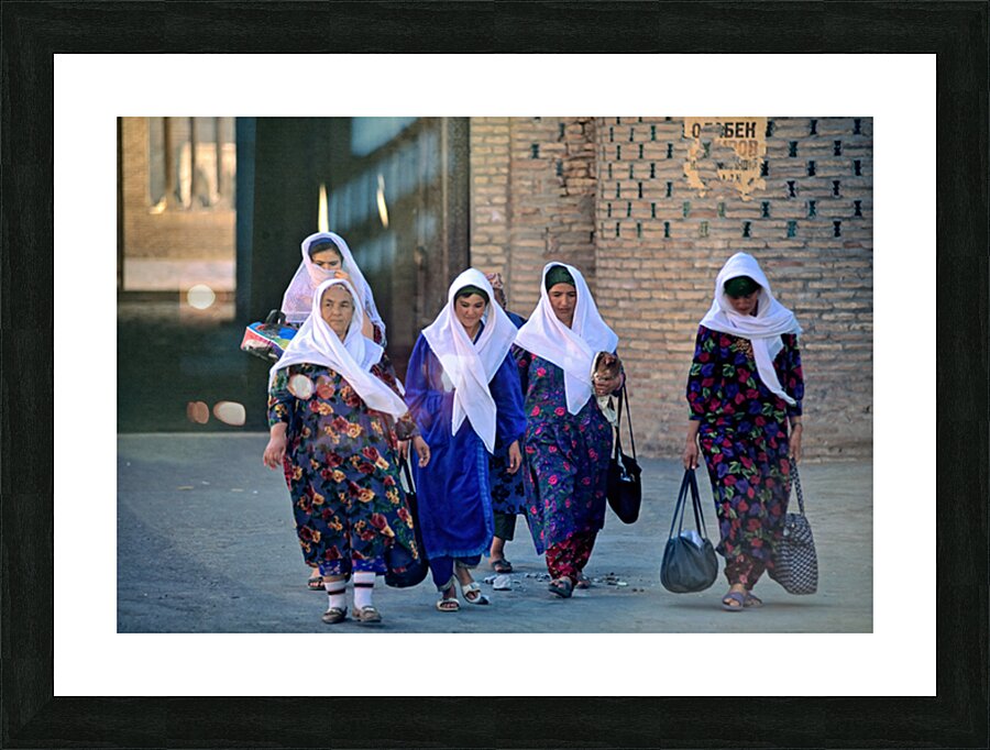 Women stroll through Khivas streets with tradition Picture Frame print
