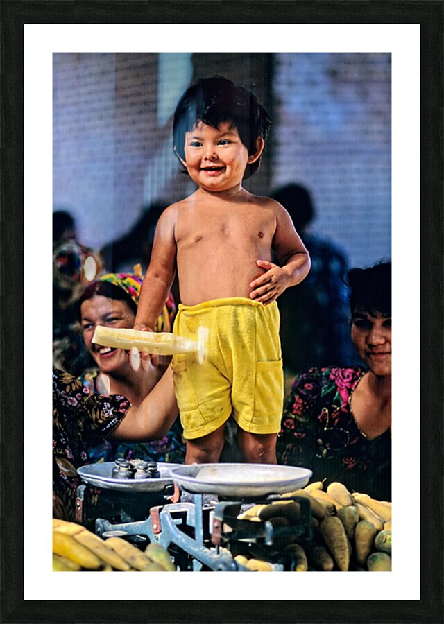 Kid stands at vegetable market in Samarkand Uzbekistan Picture Frame print