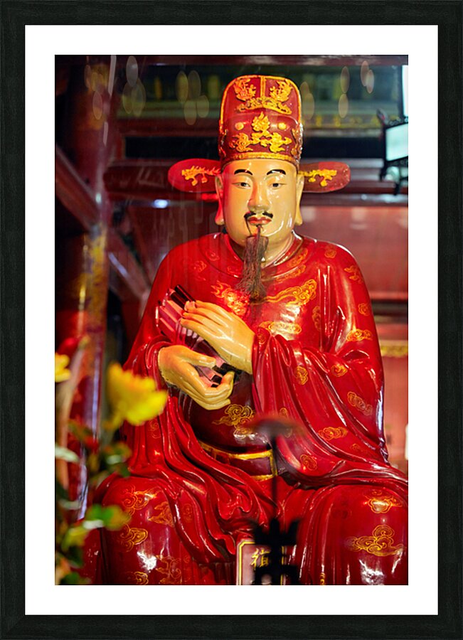 Statue of a deity in Hanoi Vietnam showing traditional clothing Picture Frame print