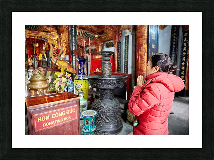 Praying at a temple in Ho Chi Minh City Vietnam Picture Frame print