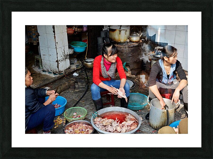Women preparing fish in a market in Hanoi Vietnam Picture Frame print