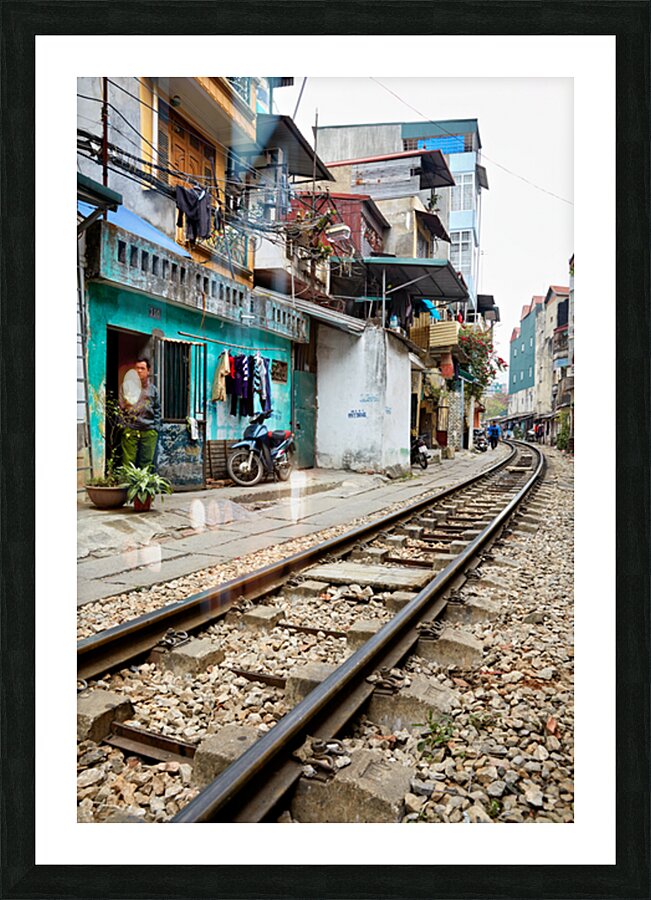Locals near train tracks in Ho Chi Minh City Vietnam Picture Frame print