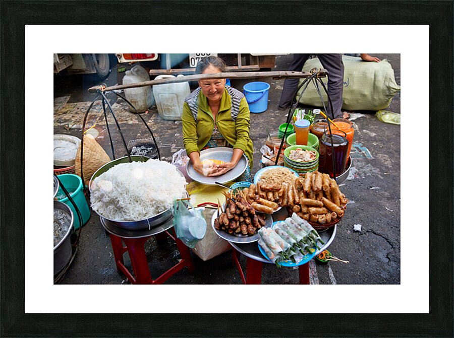 Woman selling food at street market in Ho Chi Minh City Picture Frame print