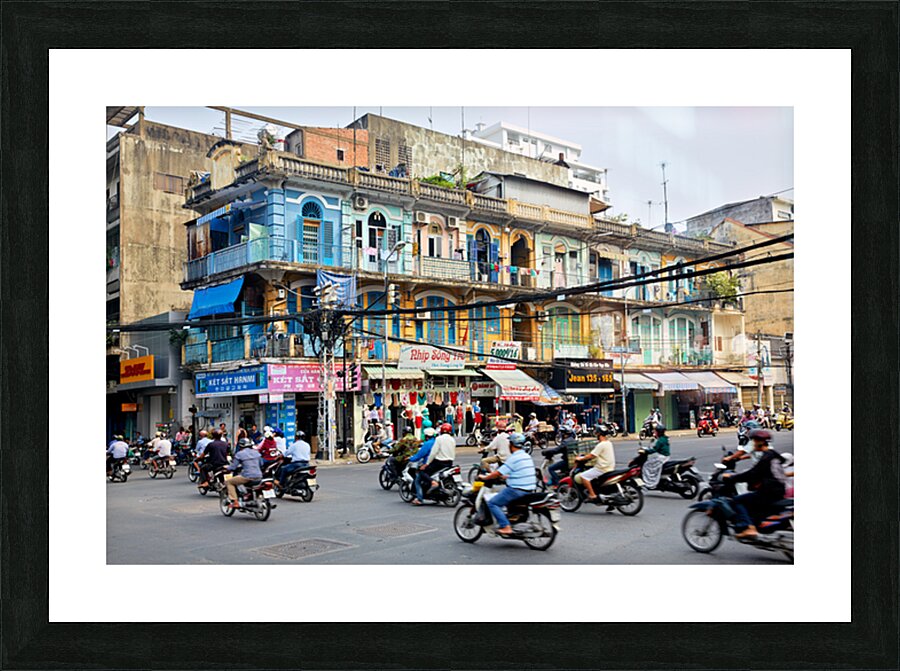 Busy street scene in Ho Chi Minh City with motorbikes and shops Picture Frame print