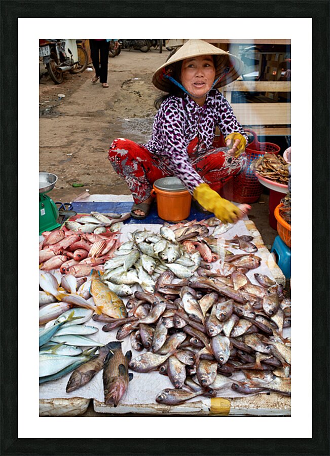 Fish seller in Phu Quoc market shows fresh catch for sale Picture Frame print
