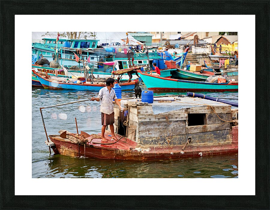 Fishing boat on water in Phu Quoc Vietnam during the day Picture Frame print