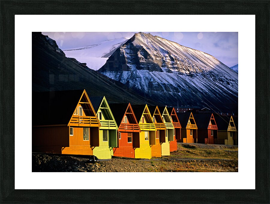 Colorful cabins in Longyearbyen Svalbard near snowy mountains Picture Frame print