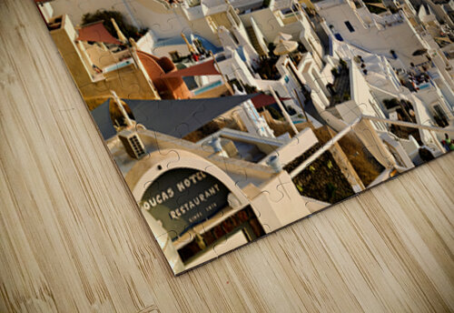 Santorinis white buildings cascade down cliff to the sea. Marco Brivio puzzle