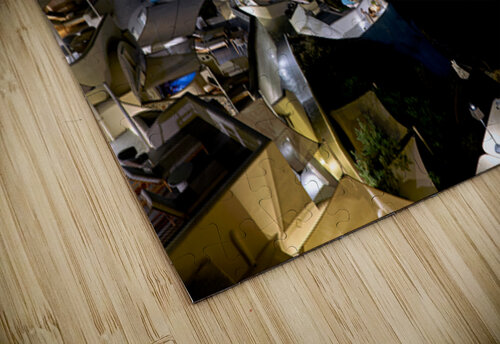 Illuminated cliffside town at night couple enjoying dinner. Marco Brivio puzzle