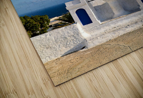 White bell tower against blue sky and sea. Marco Brivio puzzle