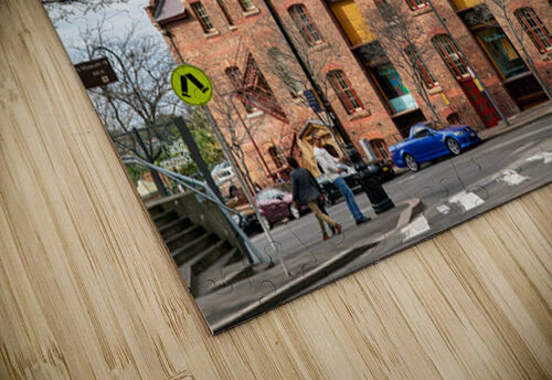 Historic brick building with a tower and people walking. Marco Brivio puzzle