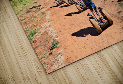 Tourists ride Segways near Uluru in Australia. Marco Brivio puzzle