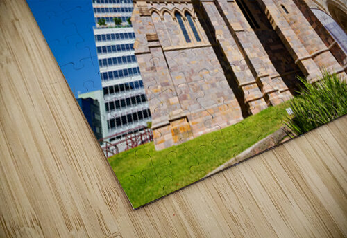 Historic church stands tall next to modern skyscrapers. Marco Brivio puzzle