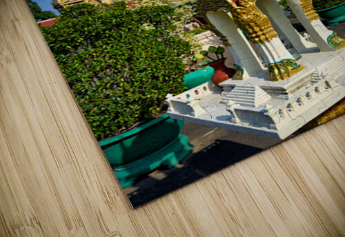 Golden temples and a grey stupa under a clear blue sky. Marco Brivio puzzle
