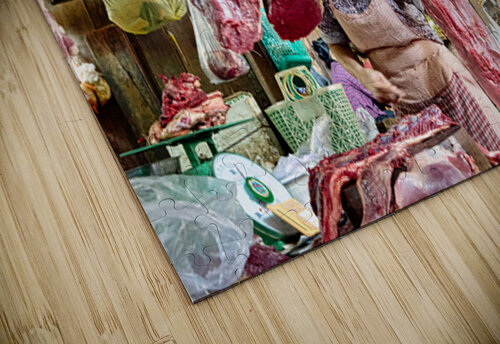 Woman selling raw meat in a bustling market. Marco Brivio puzzle
