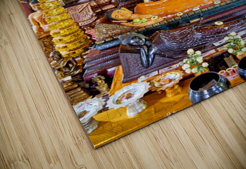Golden Buddha statues and offerings in an ornate temple. Marco Brivio puzzle