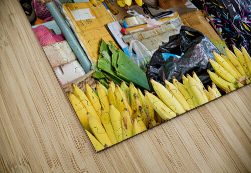 Market vendor surrounded by abundant yellow bananas. Marco Brivio puzzle