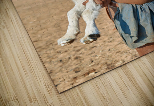 Himba child holding a goat in Kunene Region of Namibia Marco Brivio puzzle