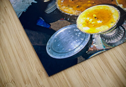 Lighting butter lamps during a ceremony in Tibet Marco Brivio puzzle