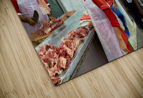 Butchers work at a busy meat market in Dubai UAE preparing fresh Marco Brivio puzzle