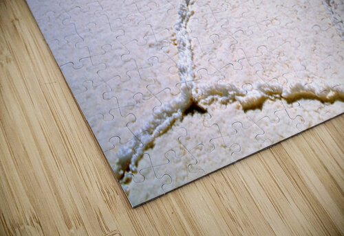 Expansive white salt flat with geometric patterns. Marco Brivio puzzle