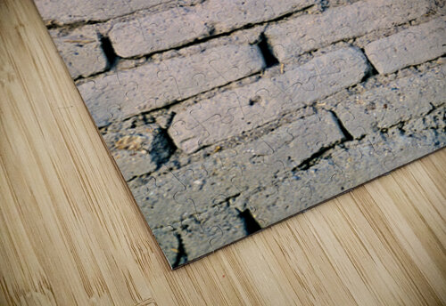 Young girl smiles over stone wall at sunset. Marco Brivio puzzle