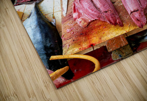 Fish market in Muscat Oman shows a vendor at work Marco Brivio puzzle