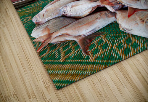 Man sells fresh fish at Muscat Oman fish market today Marco Brivio puzzle