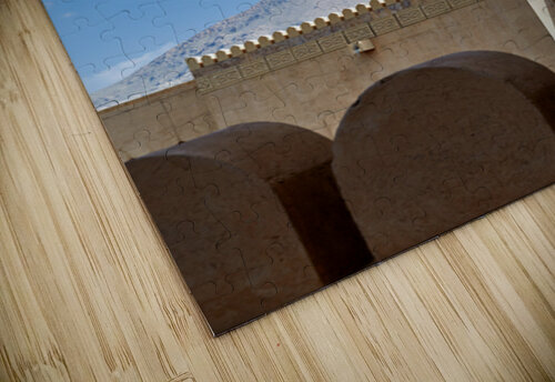Nizwa Fort shows mosque and tower with blue sky and clouds Marco Brivio puzzle