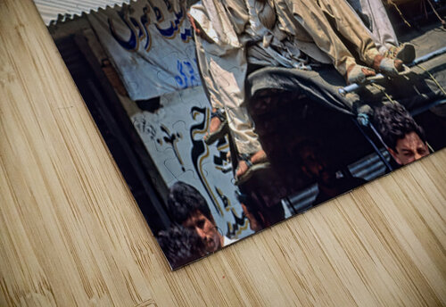 Men travel on top of a vehicle in Peshawar Pakistan Marco Brivio puzzle