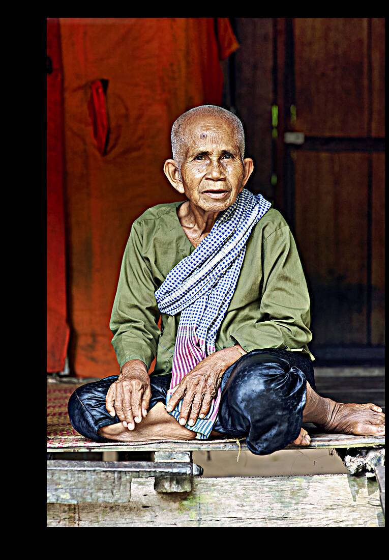 An old woman in her hut in Siem Reap. Angkor. Cambodia Reproduction