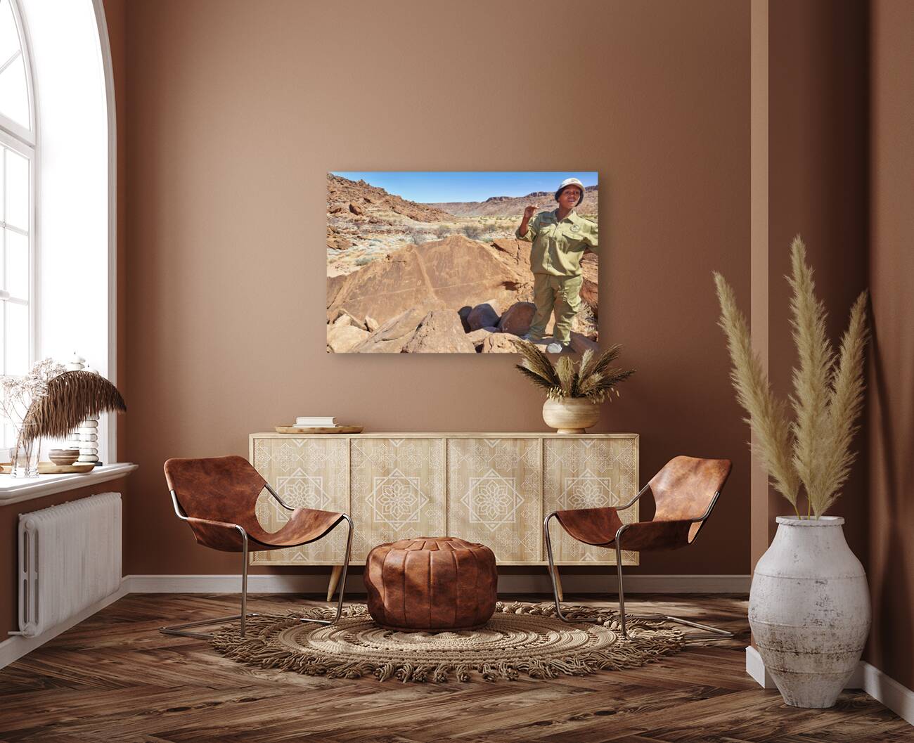 Namibia. A guide shows prehistoric rock engravings in Twyfelfontein archaeological site Reproduction