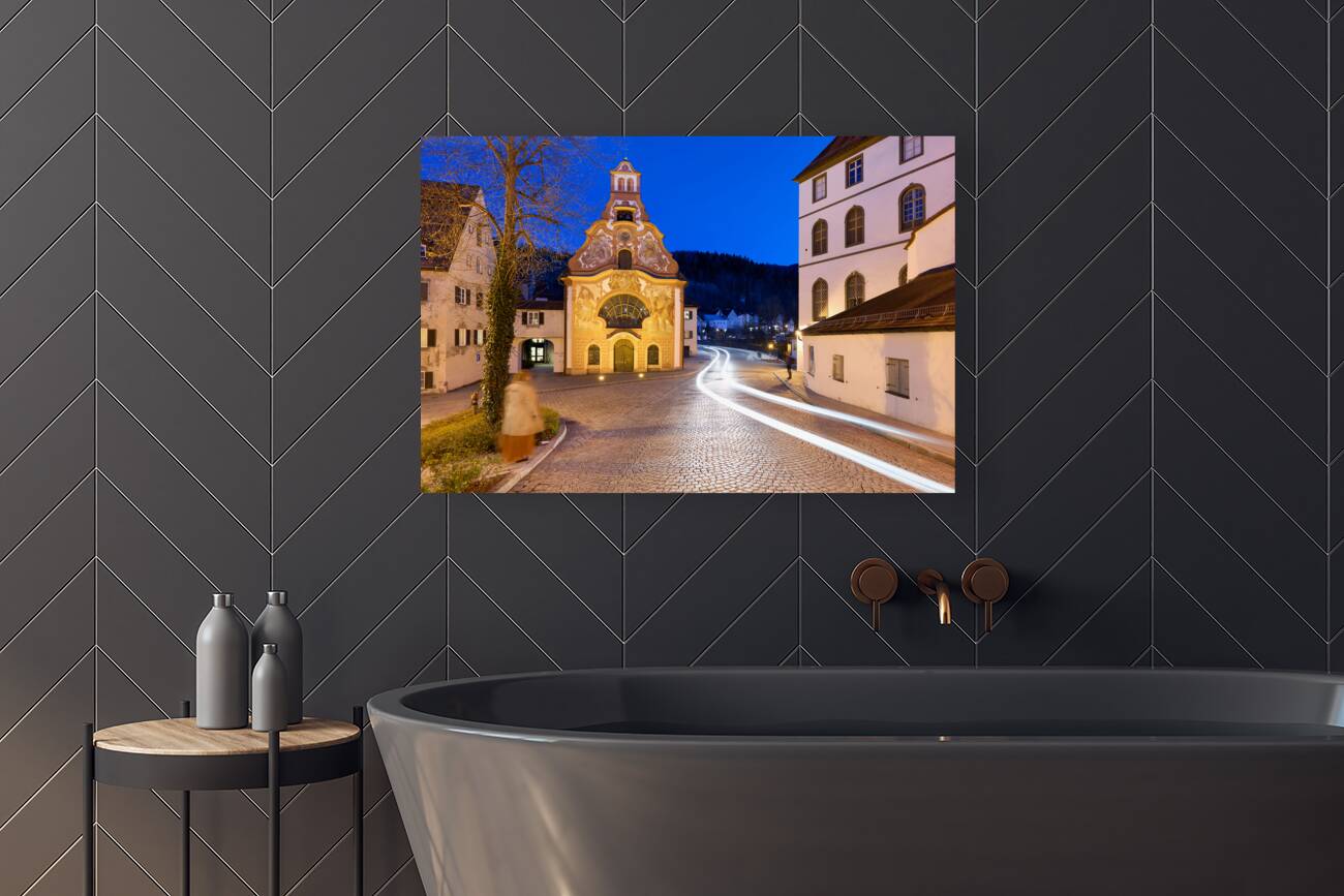 Germany Bavaria Romantic Road. Fussen. Heilig-Geist-Spitalkirche Holy Spirit Hospital Church and its rococo painted facade Reproduction