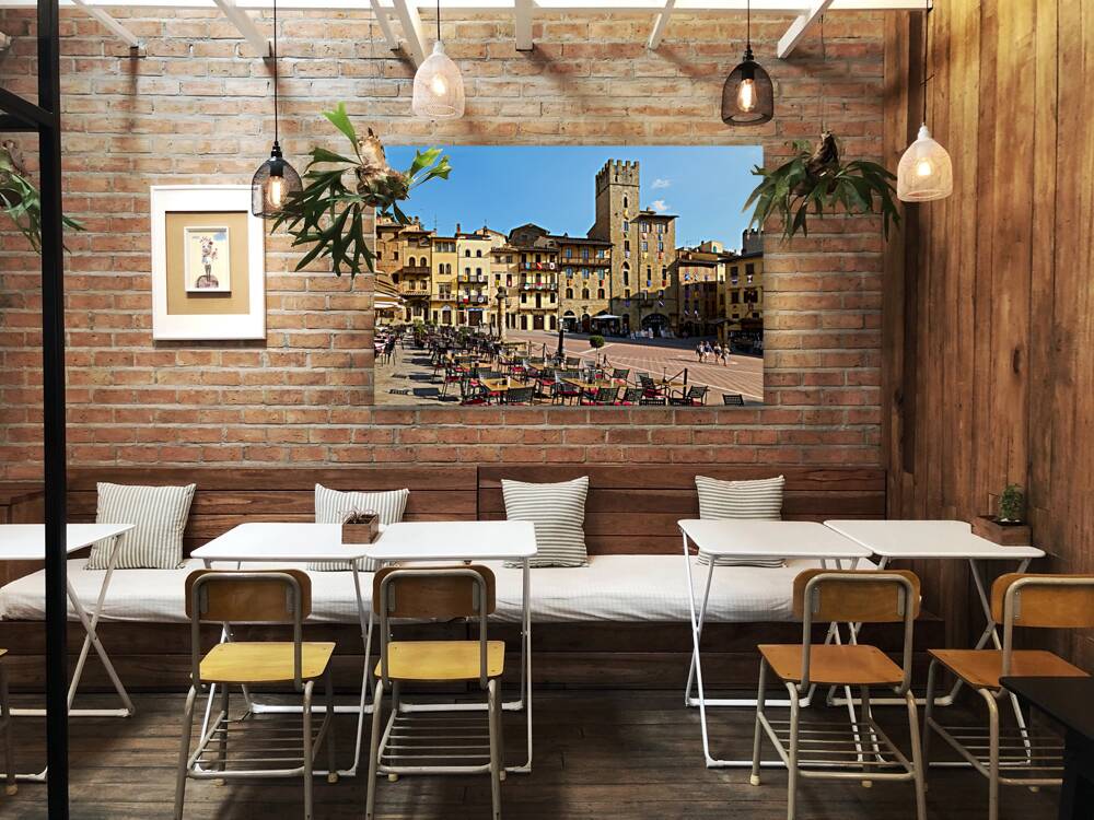 Arezzo Tuscany Italy. A group of people walking in Piazza Grande Reproduction