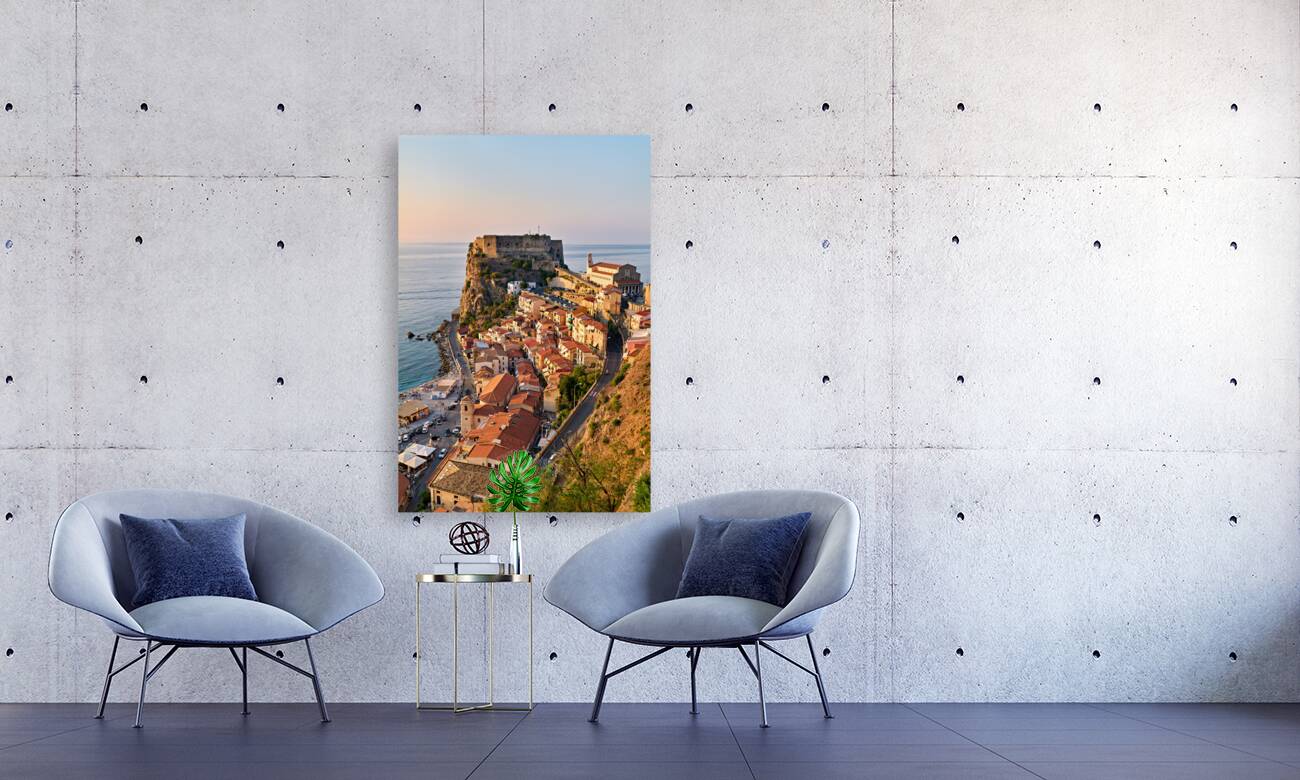 The city of Scilla Calabria Italy. Elevated view of the Ruffo castle at sunset Reproduction