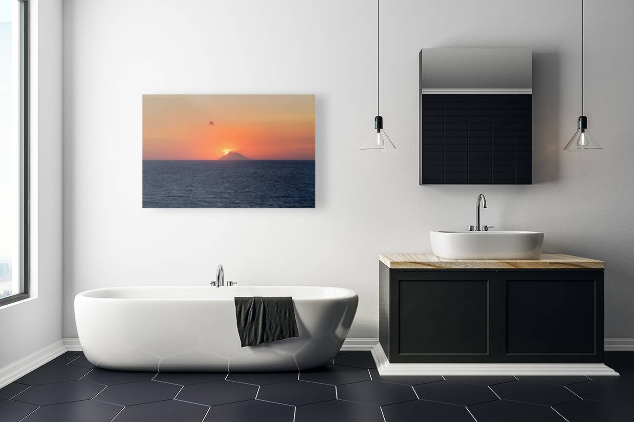 Tropea Calabria Italy. The sun sets in the crater mouth of Stromboli volcano Reproduction