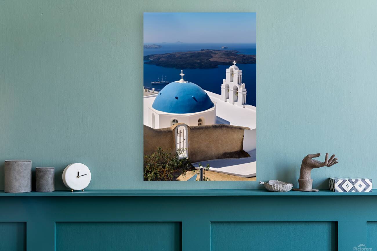 Santorinis iconic blue dome church and caldera seascape. Reproduction