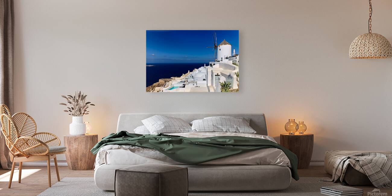 Santorinis iconic white architecture and windmill against the d Reproduction