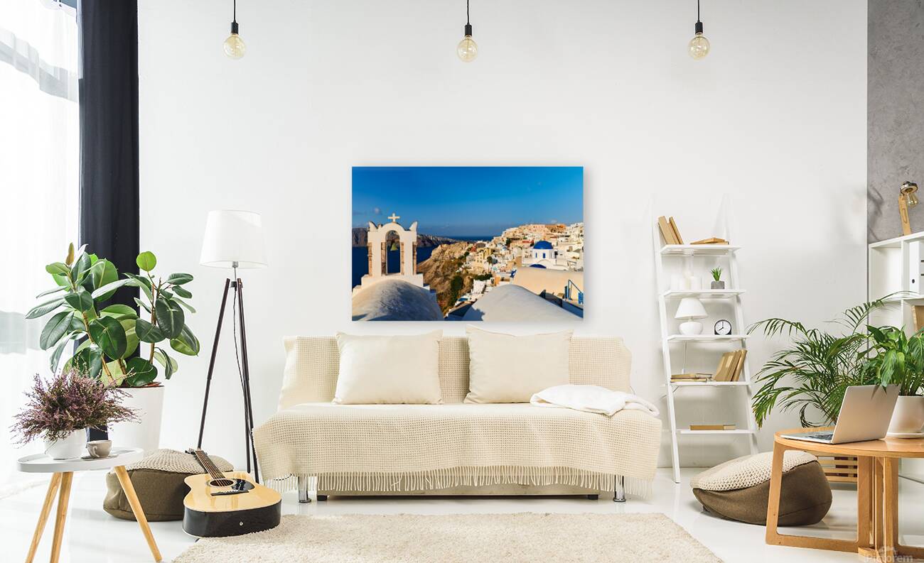 Santorini village with church bell tower overlooking caldera. Reproduction