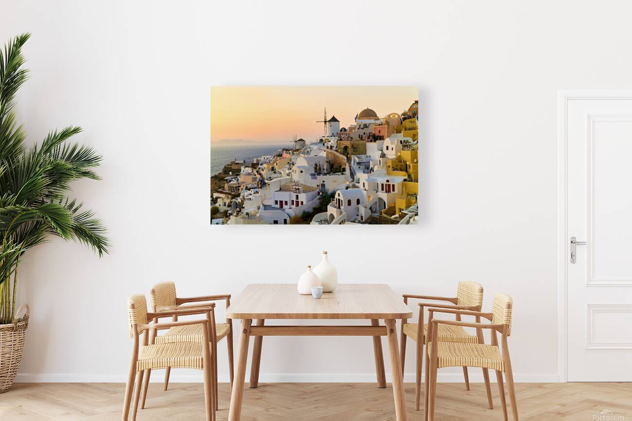 Whitewashed Santorini village and windmills at sunset over the s Reproduction