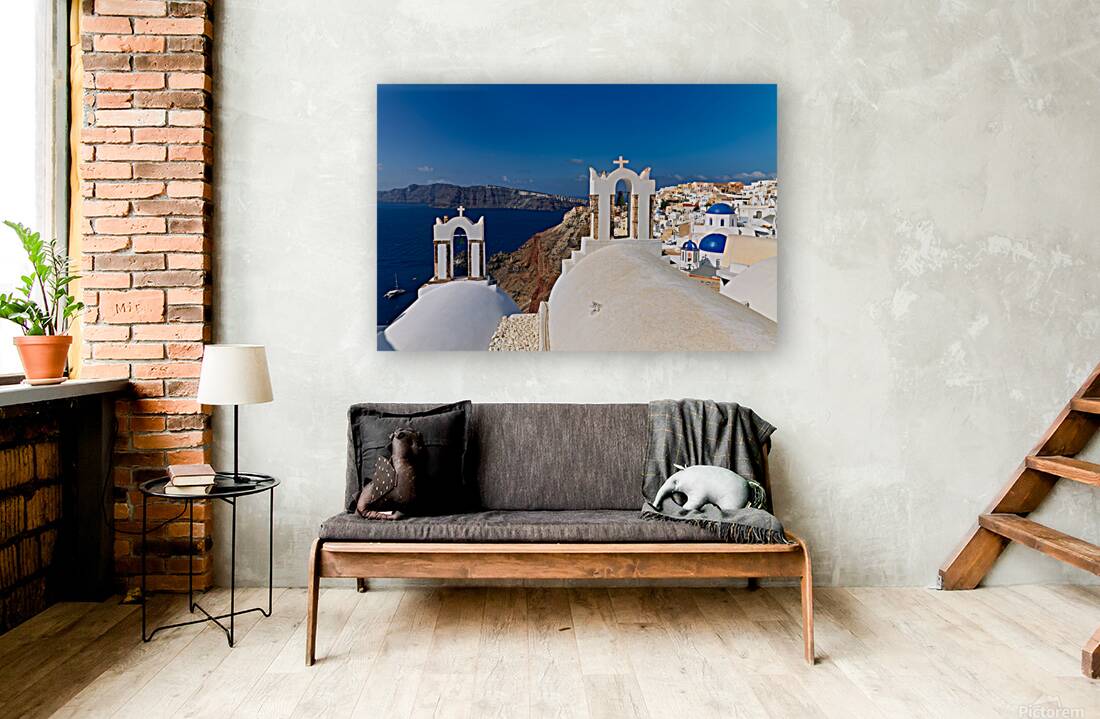 Santorinis iconic white churches blue domes and caldera view. Reproduction