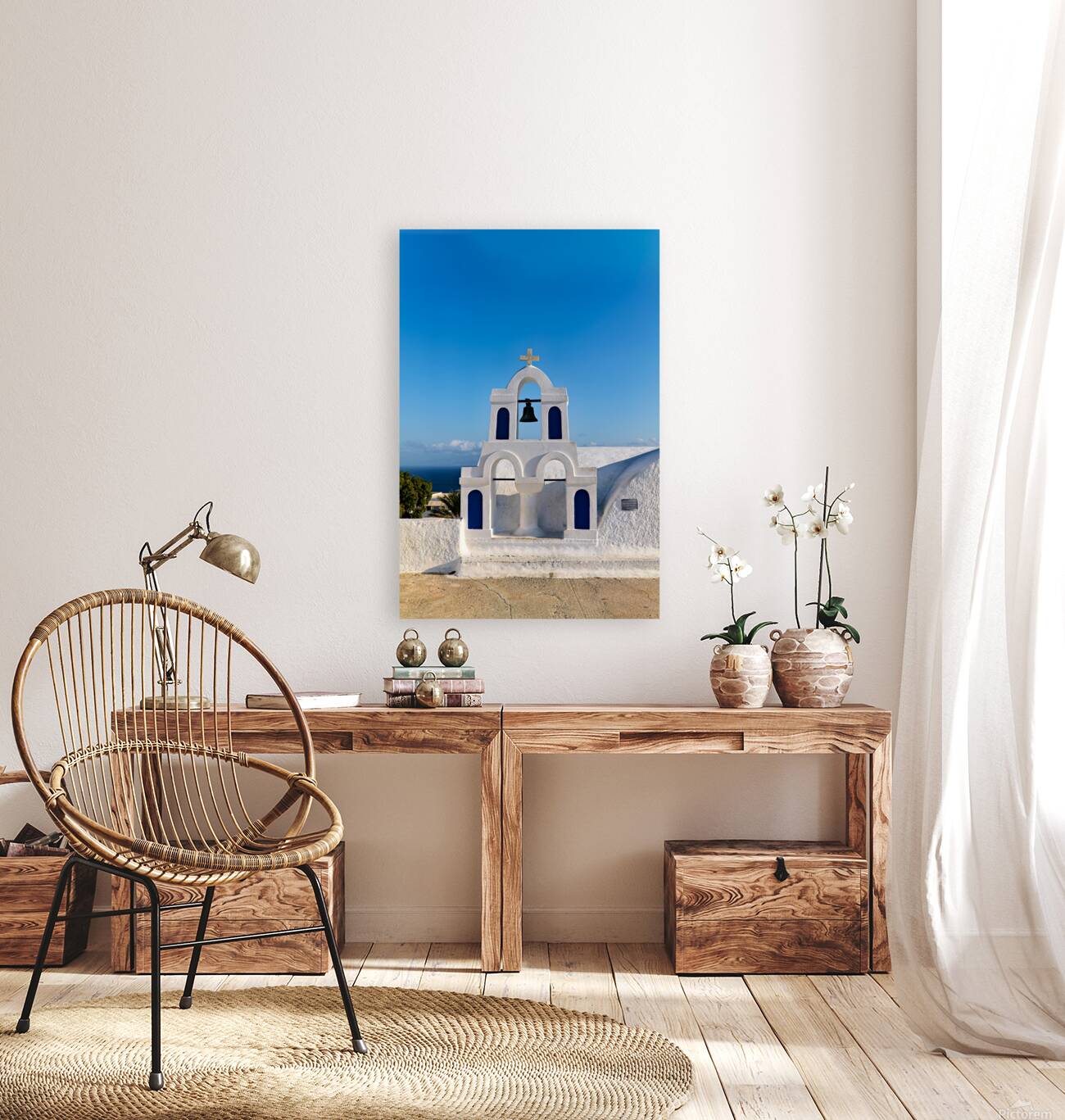 White bell tower against blue sky and sea. Reproduction