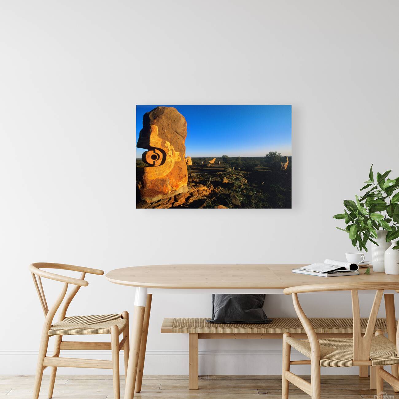 Sandstone sculptures glow at sunset in the Australian outback. Reproduction