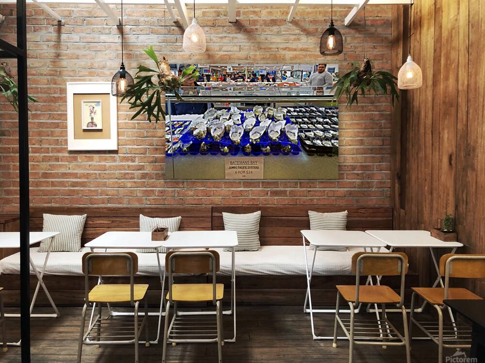 Fresh oysters on display at a seafood market. Reproduction
