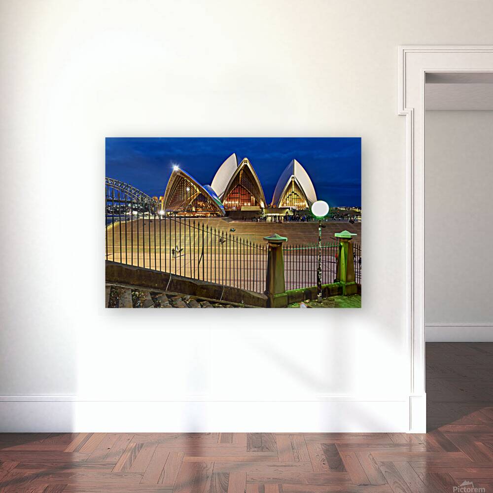 Sydney Opera House illuminated at dusk with crowds on steps. Reproduction