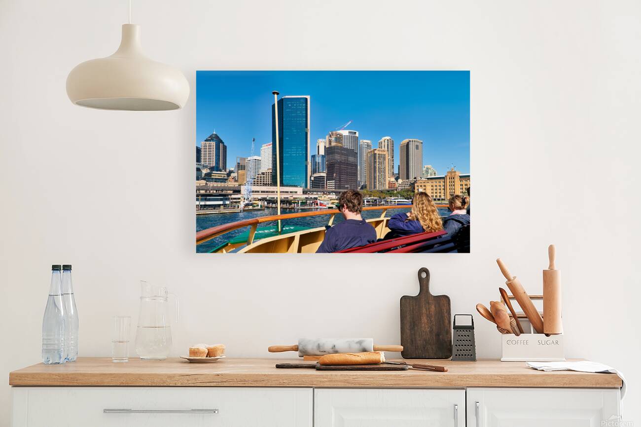 Ferry passengers enjoy city skyline view. Reproduction